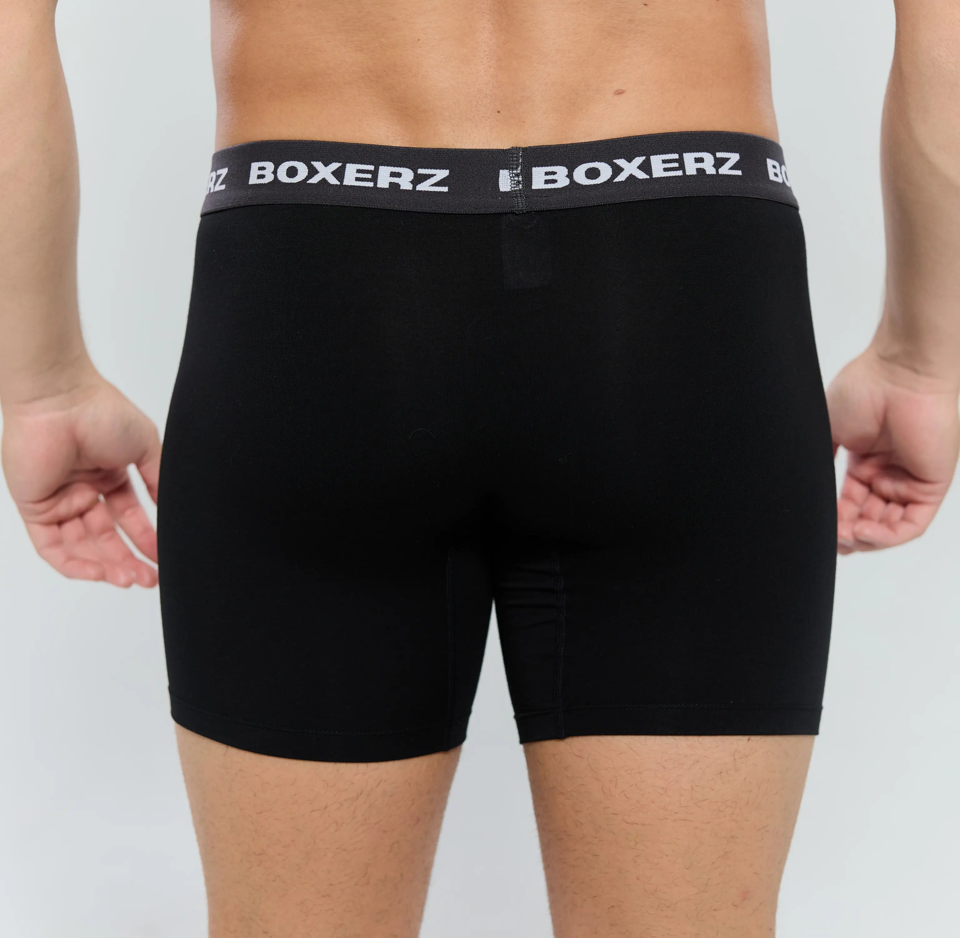 Rear view of men’s black boxer briefs from Boxerz, showcasing seamless fit and supportive design