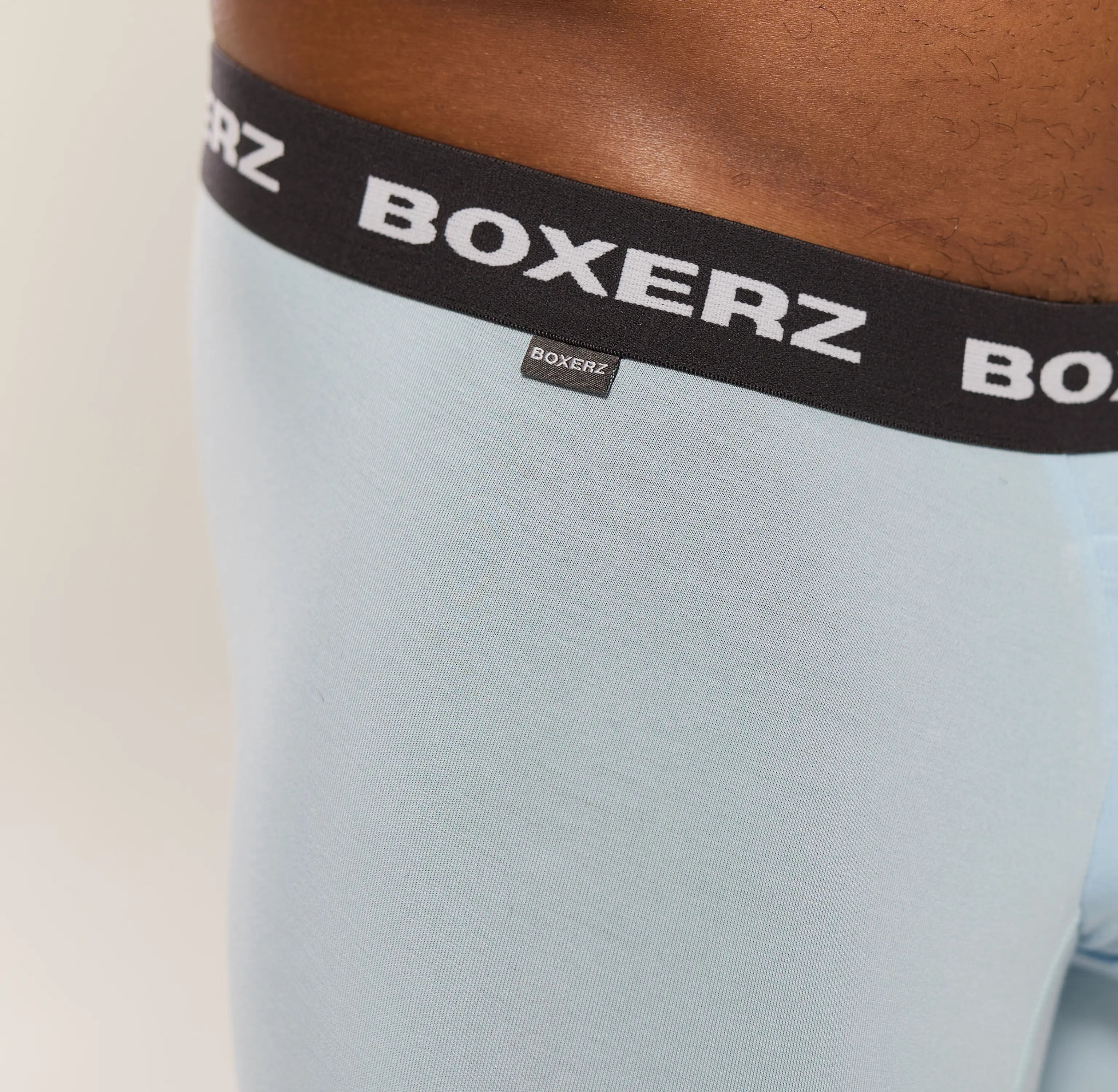Close-up of Boxerz waistband on Carolina blue boxer briefs, showing logo and stitching details