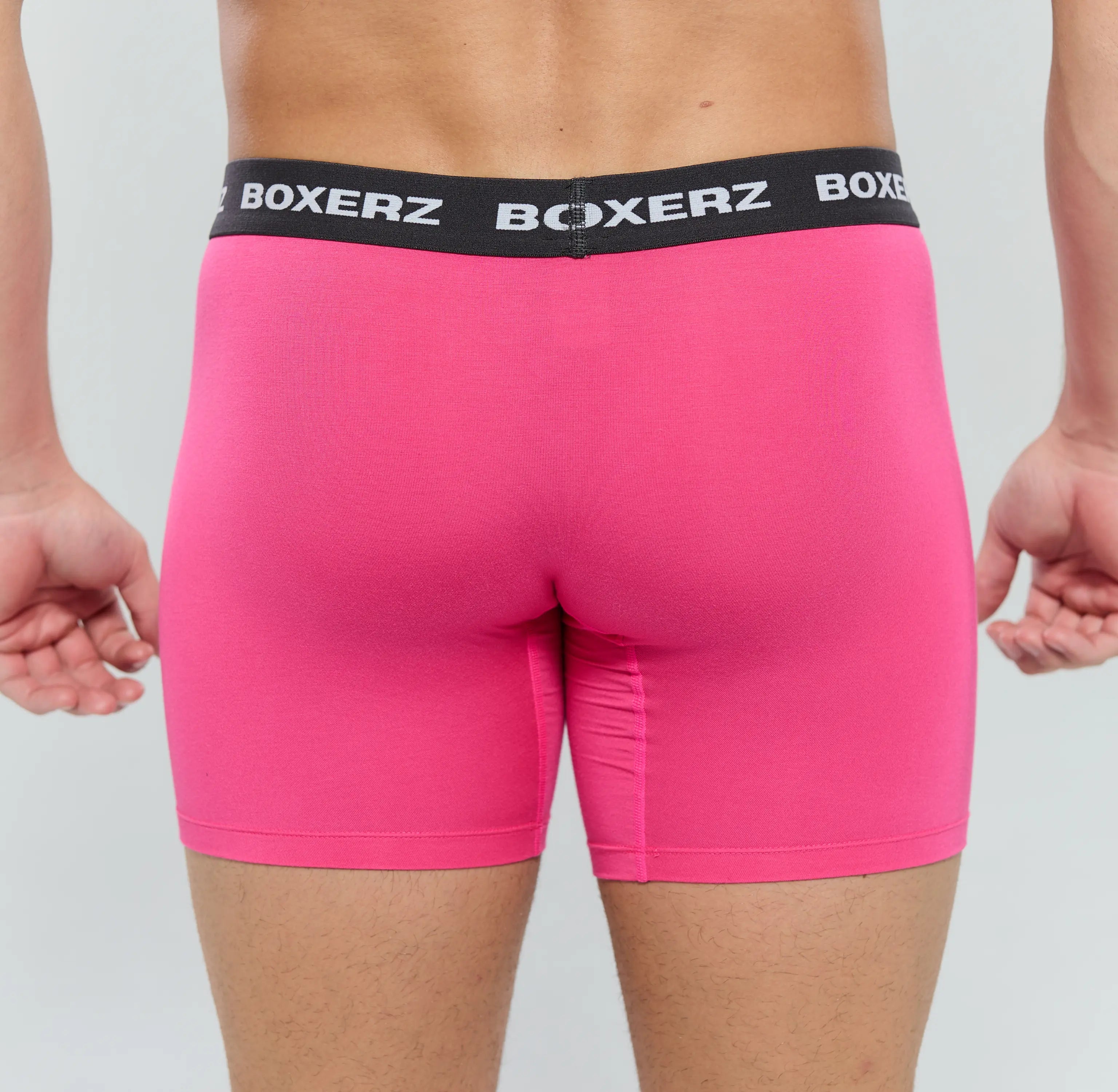 Rear view of men’s pink boxer briefs from Boxerz, showcasing seamless fit and supportive design