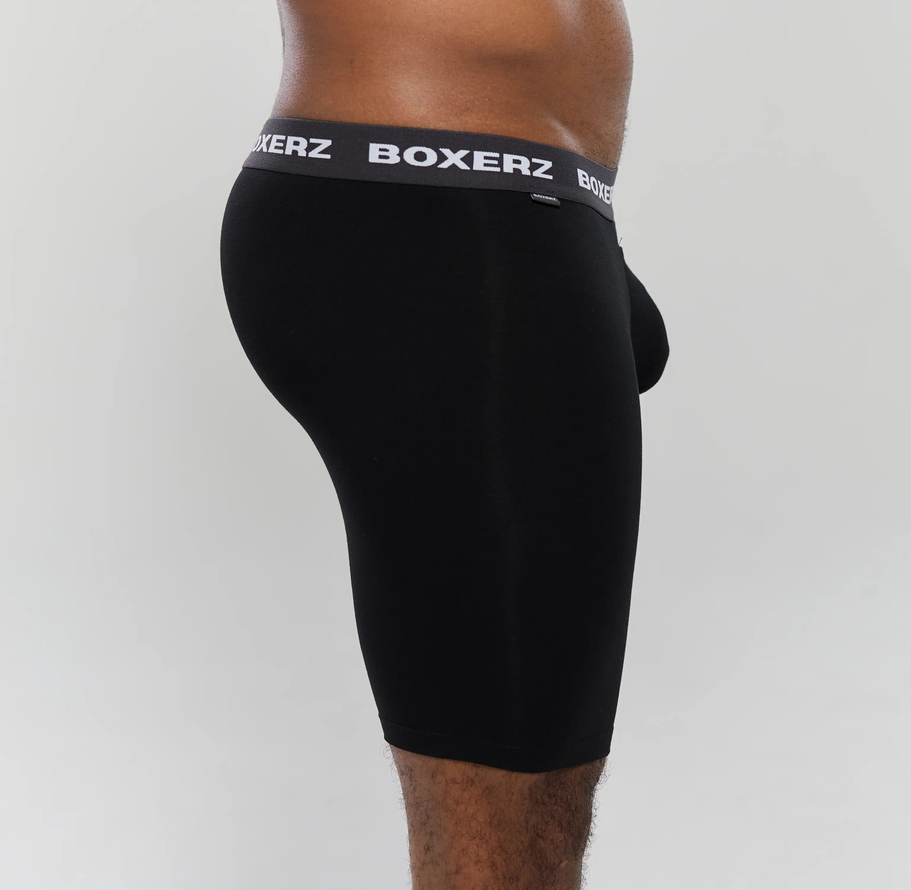 Side profile of Boxerz black boxer briefs, highlighting snug fit and stretch fabric