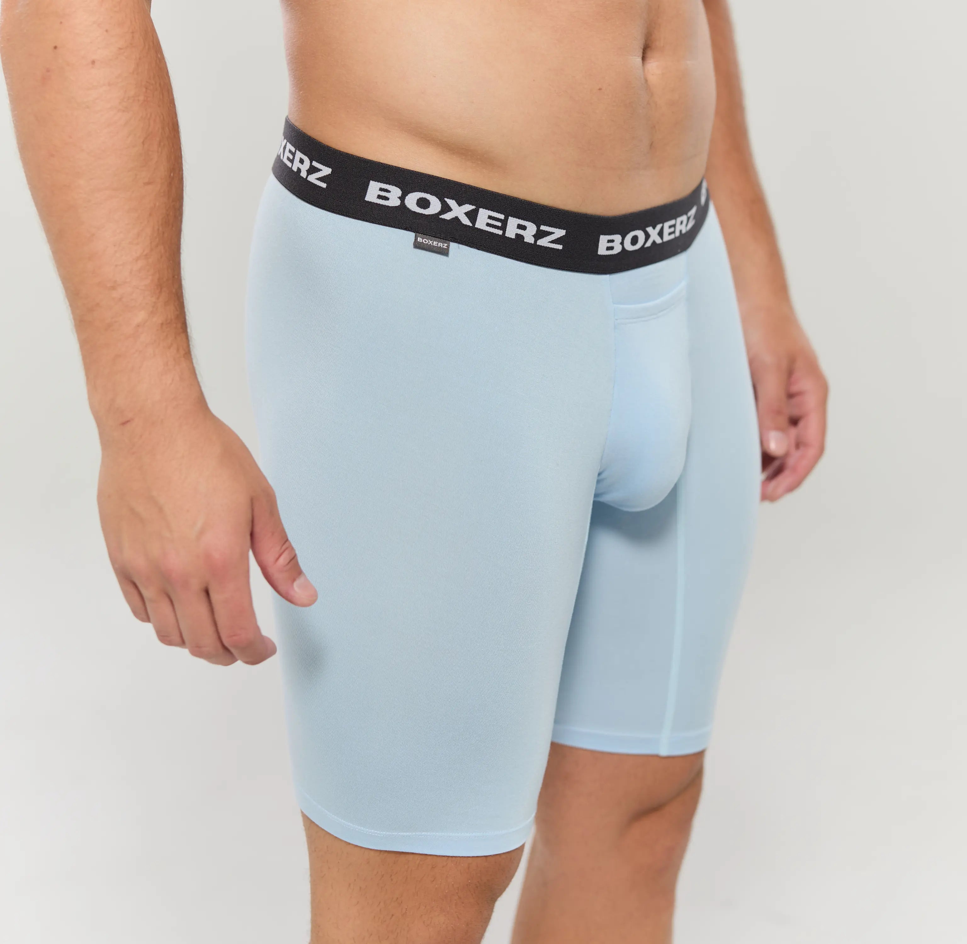 Side profile of Carolina blue boxer briefs, highlighting snug fit and stretch fabric