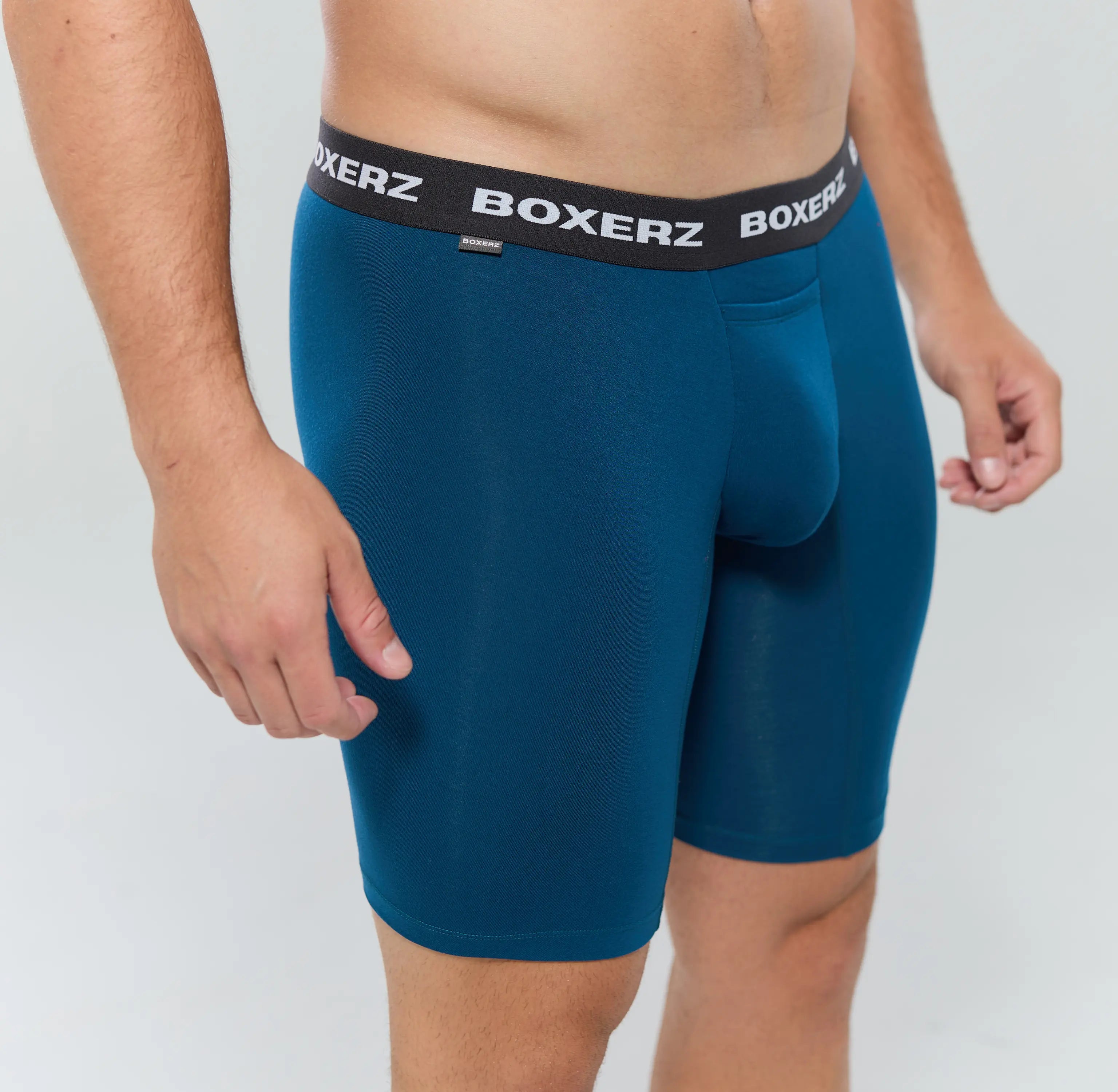Side profile of midnight blue boxer briefs, highlighting snug fit and stretch fabric