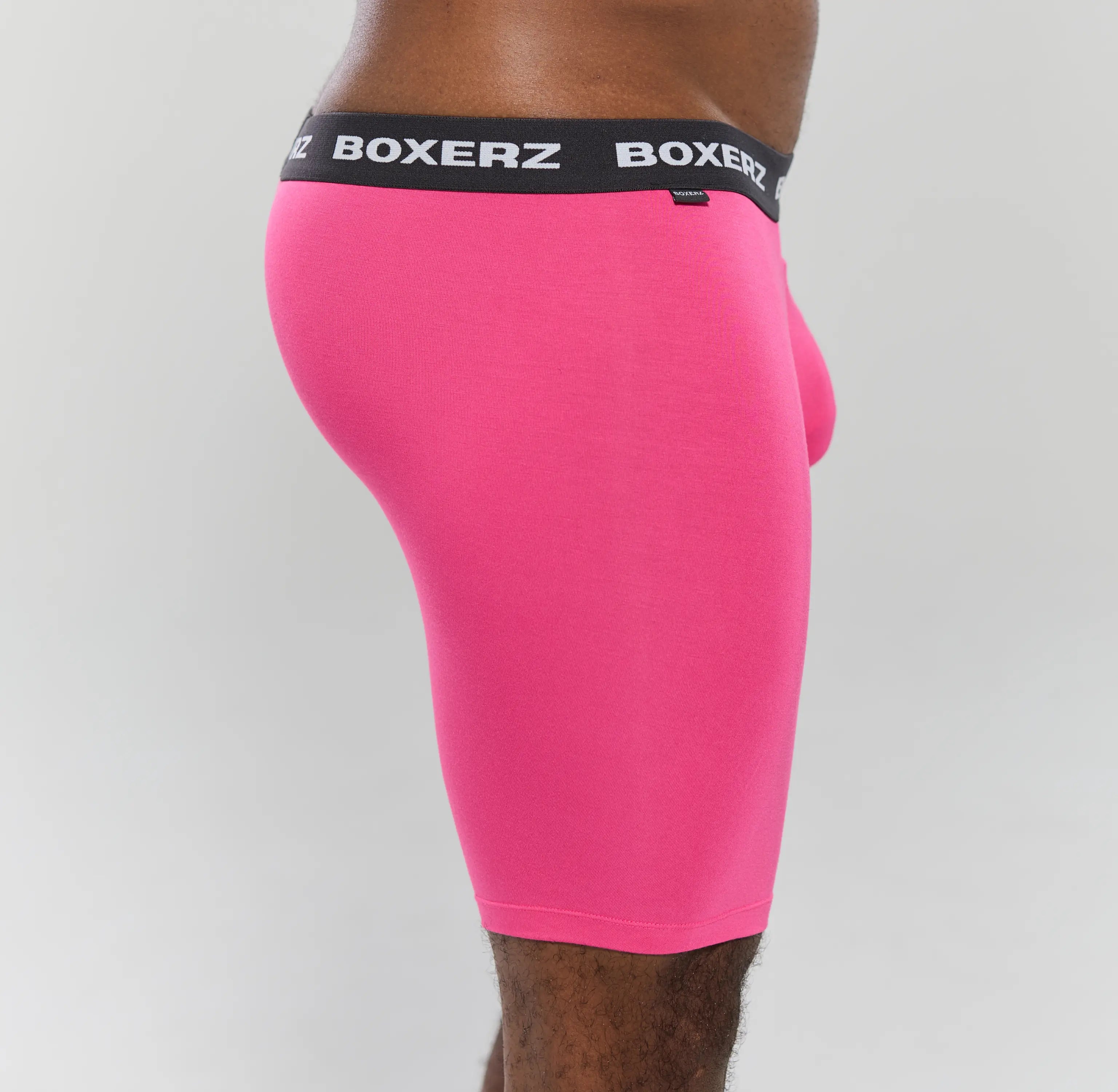 Side profile of Boxerz pink boxer briefs, highlighting snug fit and stretch fabric