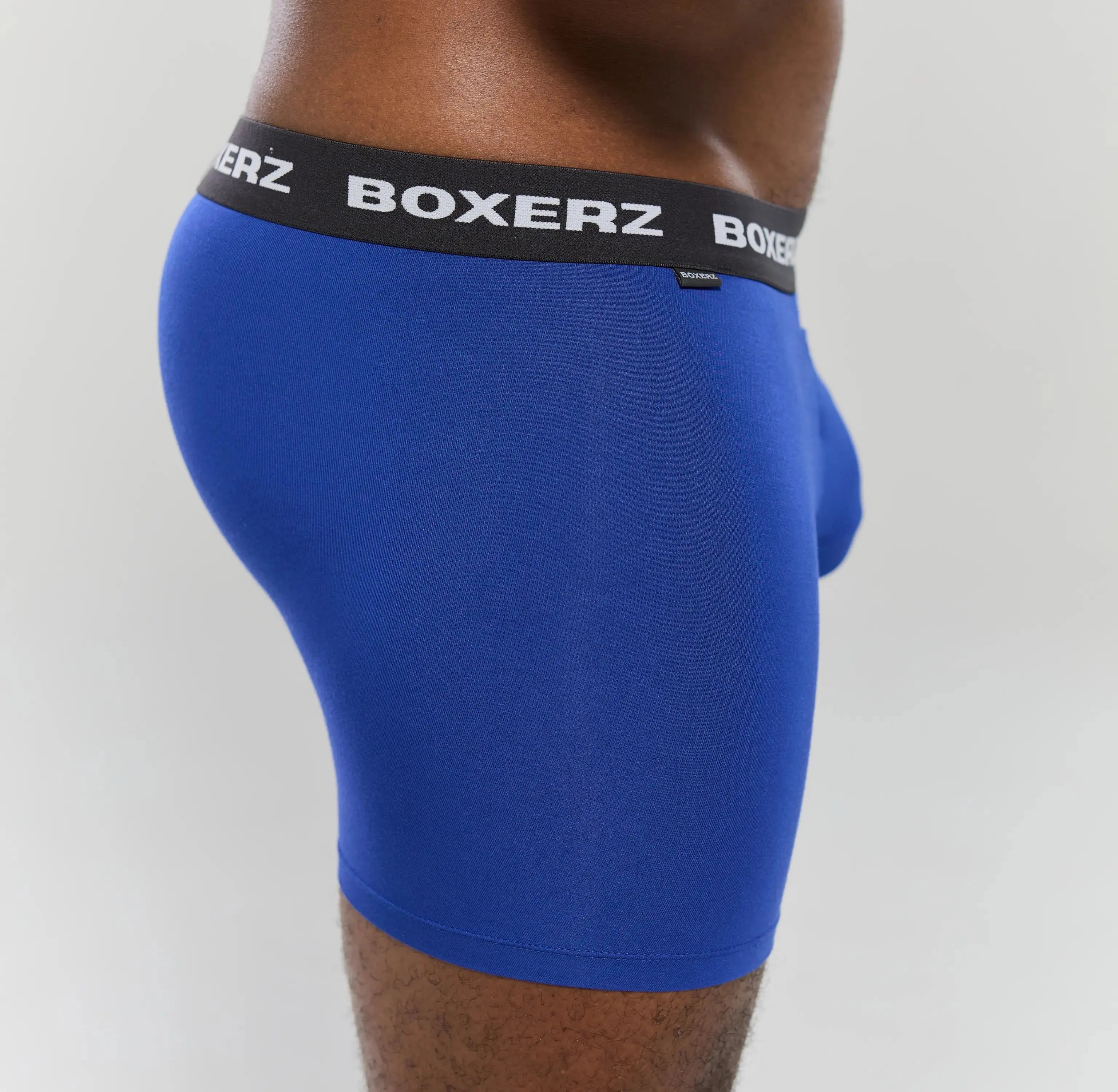 Side profile of Boxerz blue boxer briefs, highlighting snug fit and stretch fabric