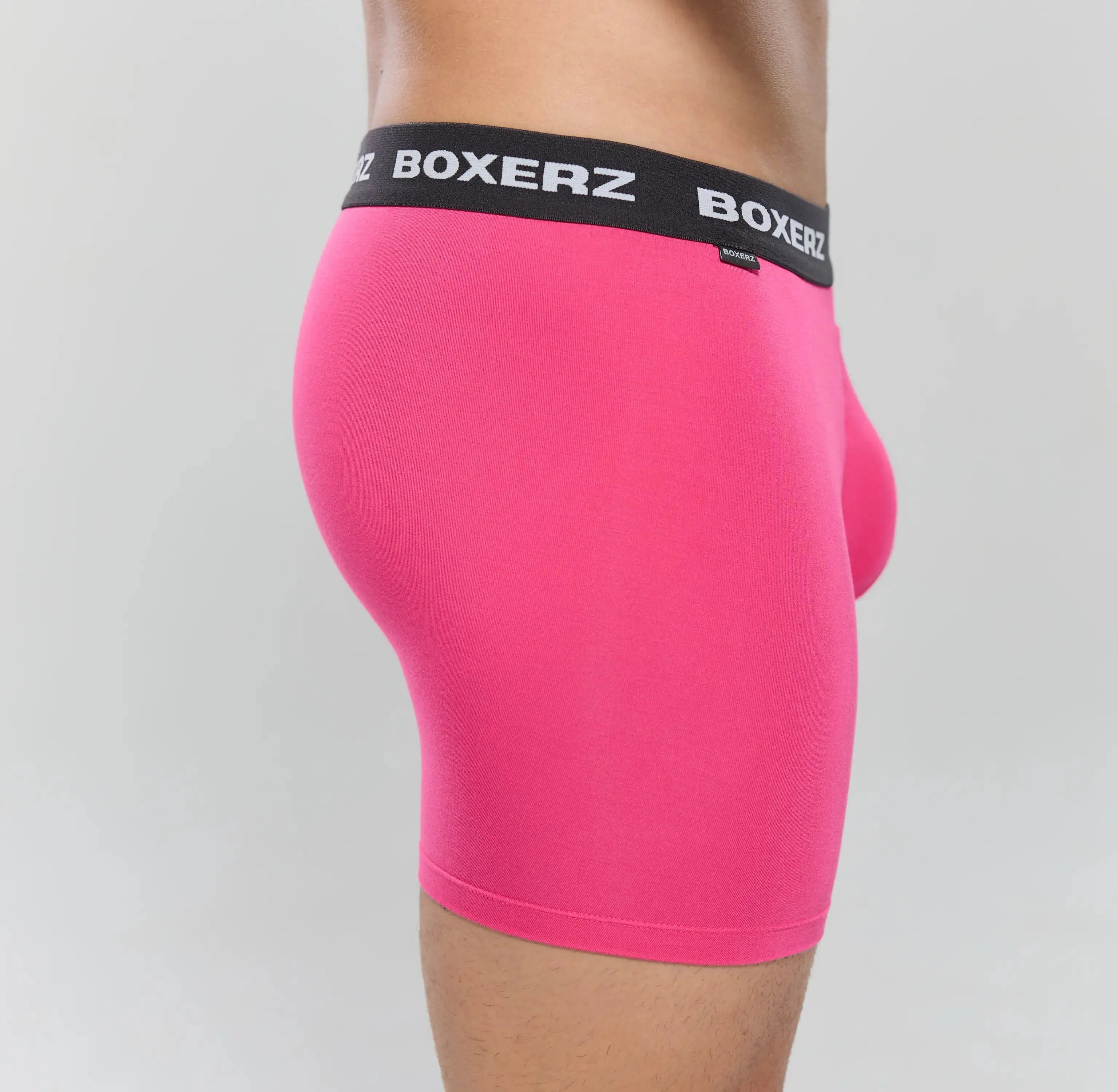 Side profile of Boxerz pink boxer briefs, highlighting snug fit and stretch fabric