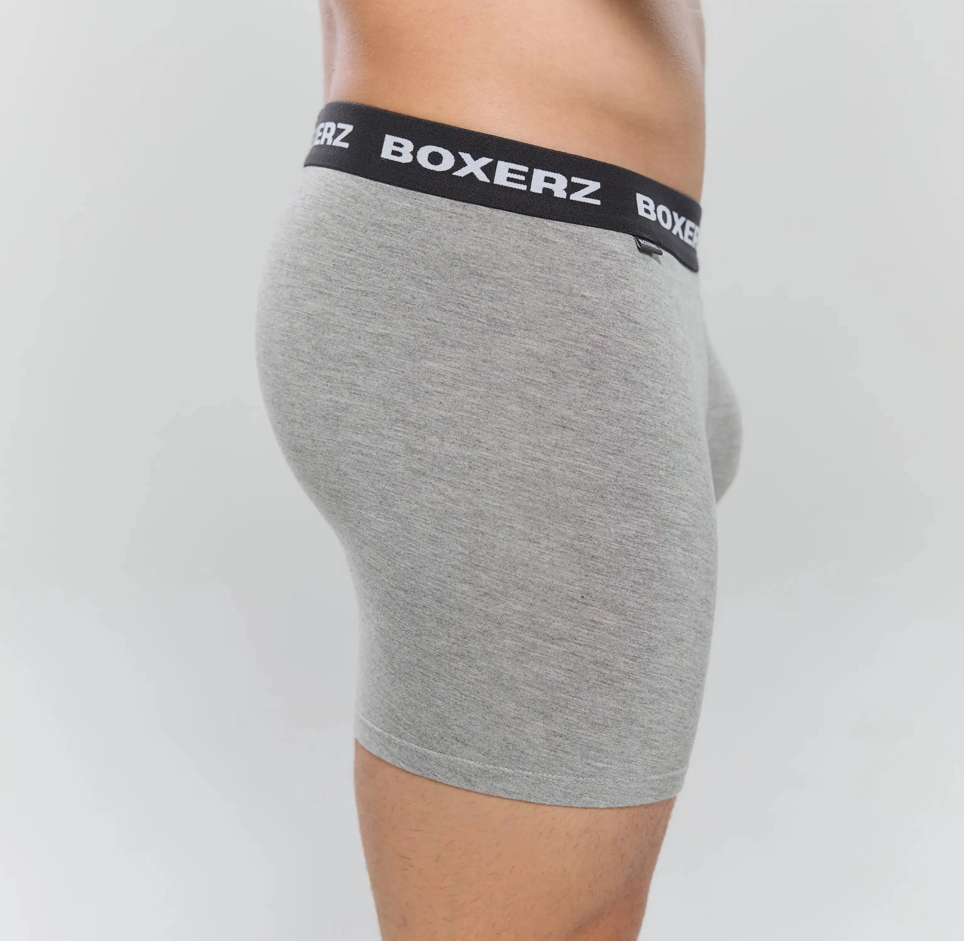 Side profile of Boxerz grey boxer briefs, highlighting snug fit and stretch fabric
