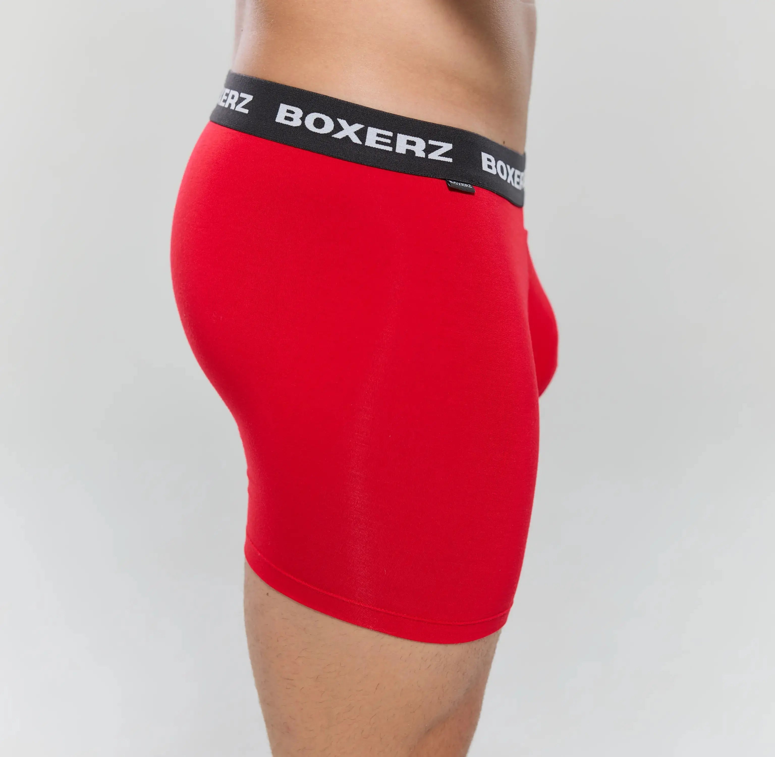 Side profile of Boxerz red boxer briefs, highlighting snug fit and stretch fabric