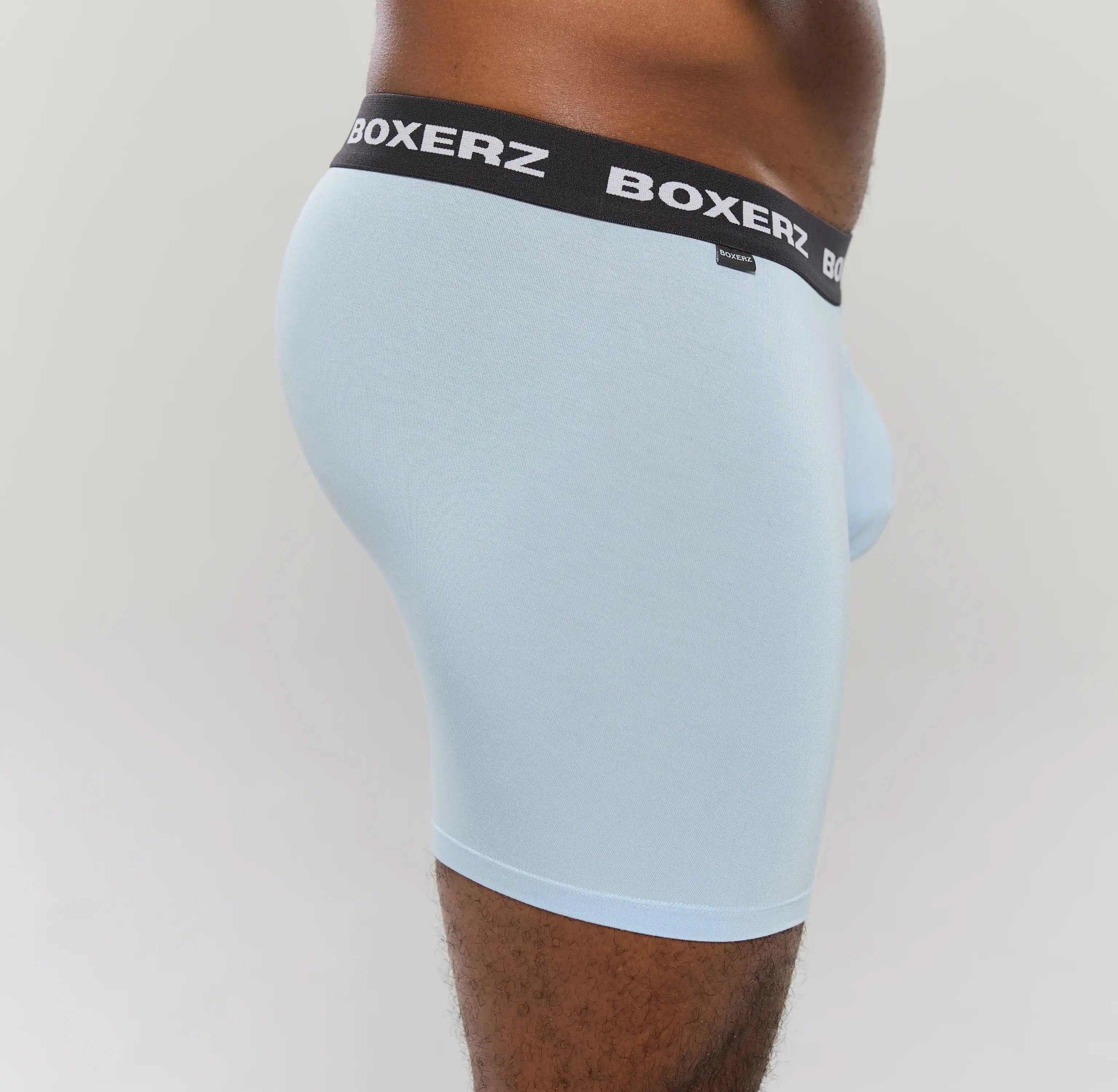 Side profile of Boxerz Carolina blue boxer briefs, highlighting snug fit and stretch fabric
