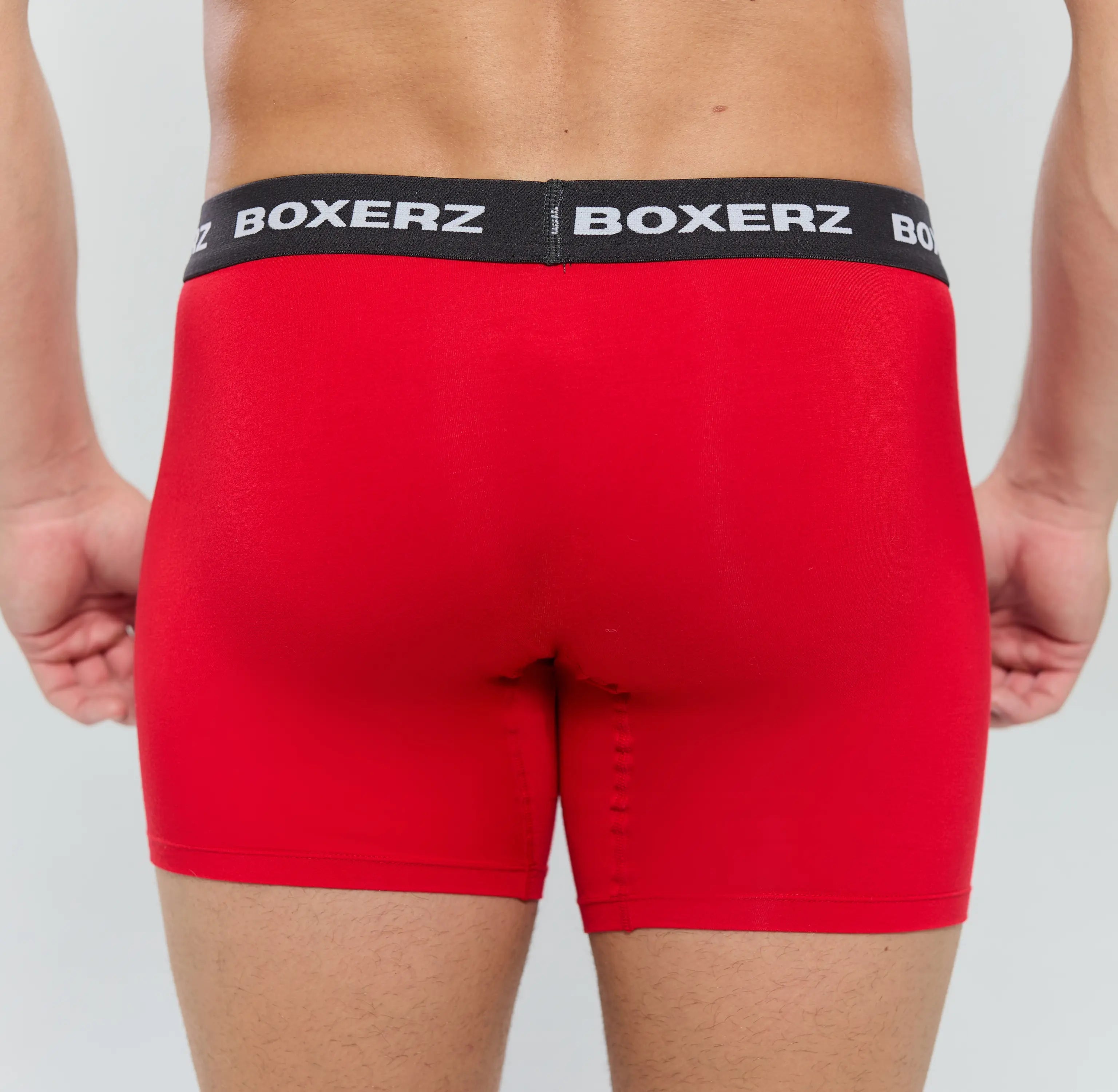 Rear view of men's red boxer briefs from Boxerz, showcasing seamless fit and supportive design