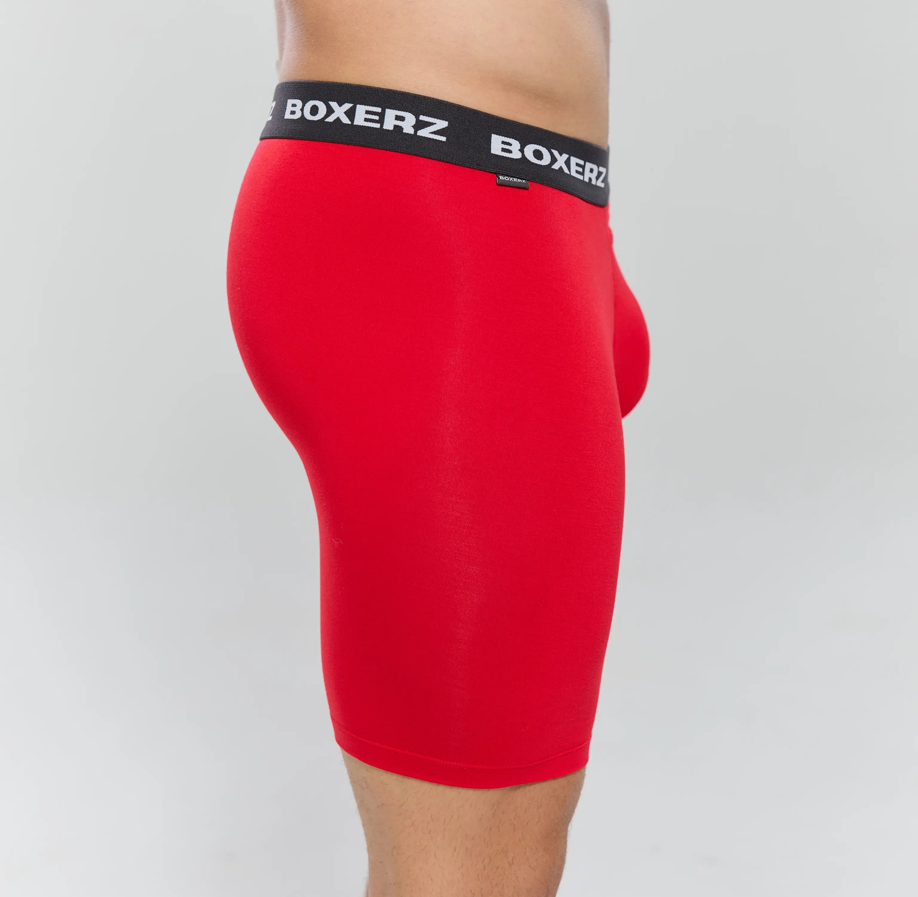 Side profile of Boxerz red Sports+ boxer briefs, highlighting snug fit and stretch fabric
