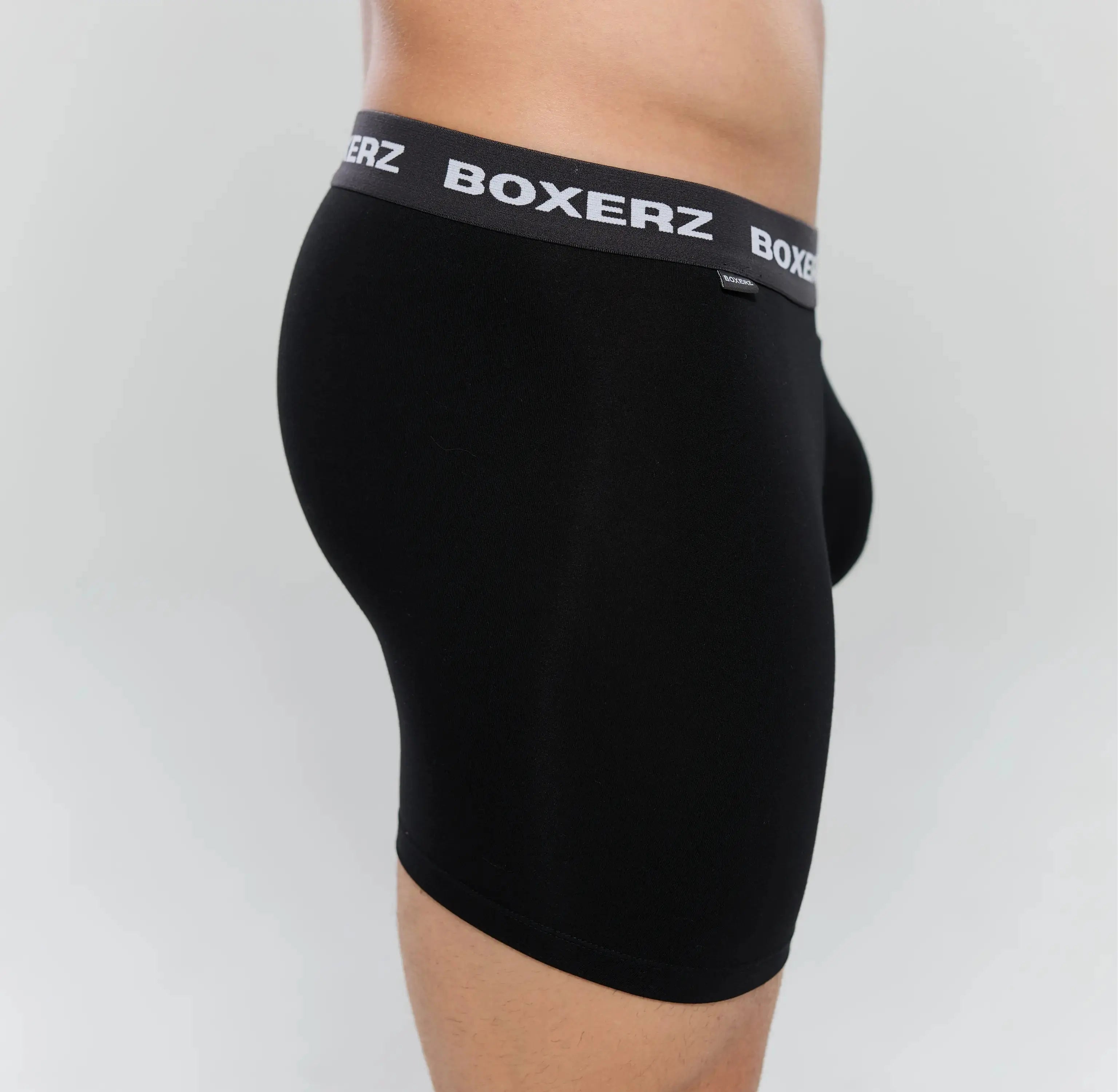 Side profile of Boxerz black boxer briefs, highlighting snug fit and stretch fabric